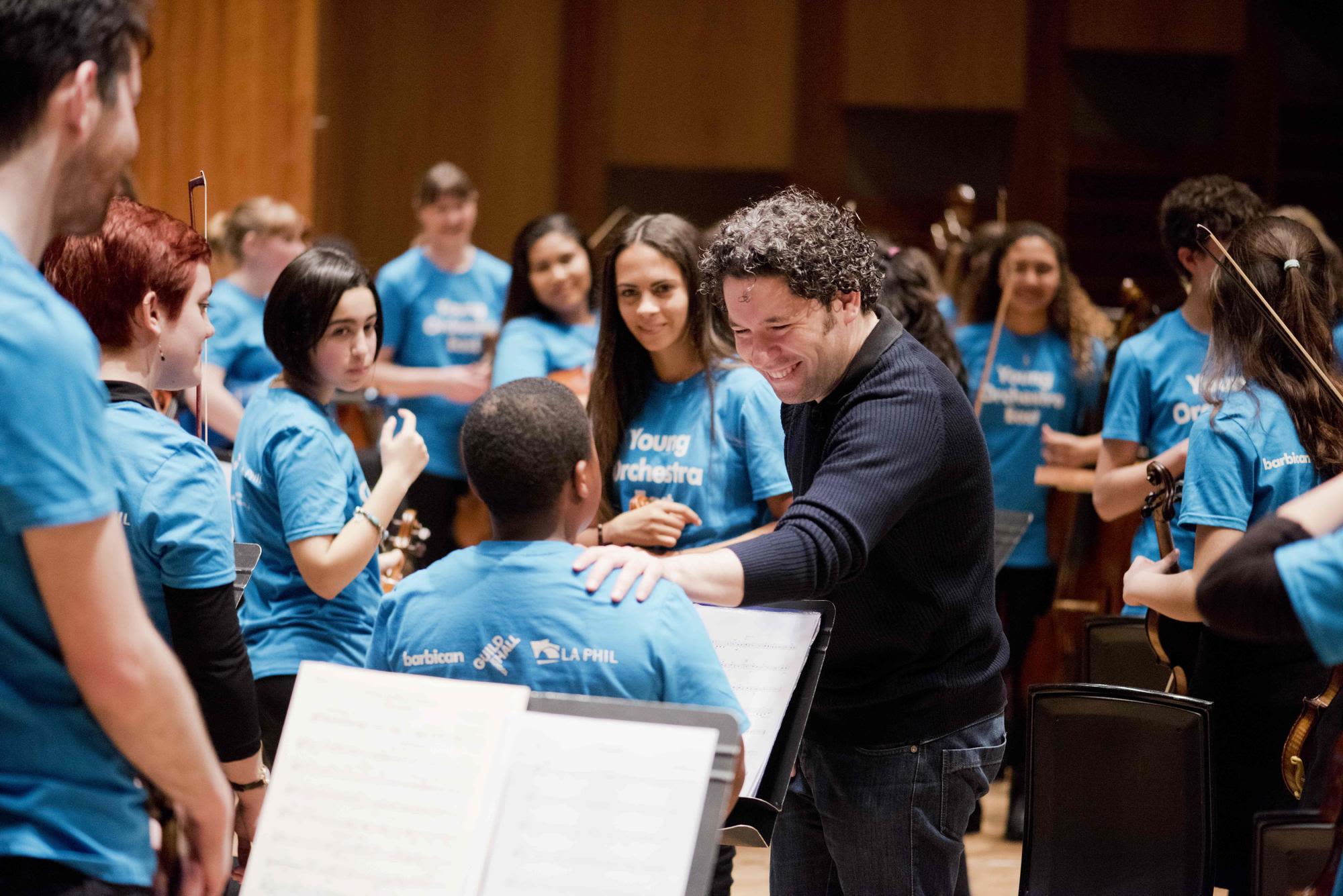 Gustavo Dudamel with young musicians from the Young Orchestra East